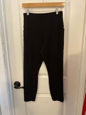 RHONE Black Athletic Leggings with Gold Logo